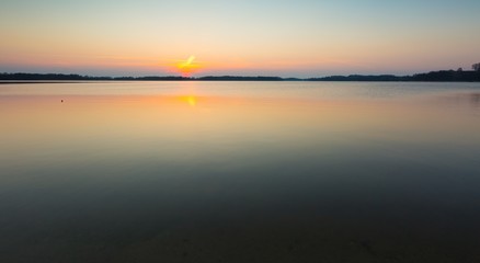 Obraz premium Lake at sunset in Mazury lake district in Poland