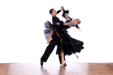 Fototapeta premium Latino dancers in ballroom against white background
