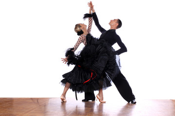 Latino dancers in ballroom against white background