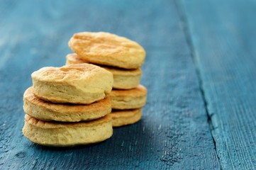 Tasty round homemade cookies on deep blue background