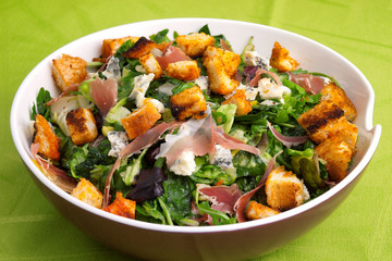 French Provencal Salad with green salad, bacon, croutons and blue cheese. Full length view.