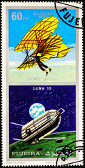 A stamp printed in Fujeira shows spacecraft Luna 10 and ancient glider (1852), series 
