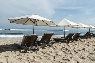 Balangan beach with parasol, Nusa Dua, is one of the most beautiful in Bali, it is called Mars at its bottom is covered with volcanic rock.