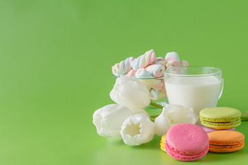Kid breakfast with white tulips and sweets