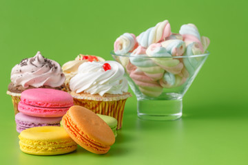 Sweets on plain green background