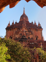 Outdoors view of Htilominlo Temple in Bagan, Myanmar. Vertical shot
