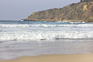 Fototapeta na wymiar Small waves at the beach
