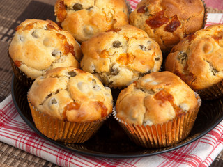 Savory muffins with ham, cheese dried tomatoes, horizontal shot