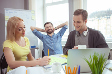 Cute friendly team is working in cooperation