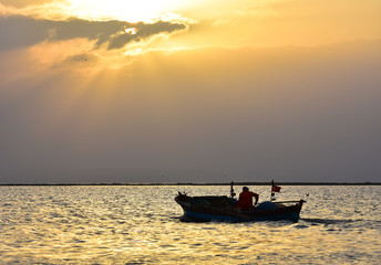 Fishing boat on sunset