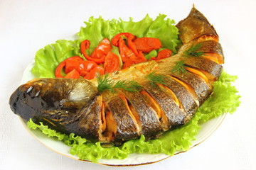 baked silver carp  with tomato and lemon
