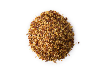 A pile of crushed red pepper flakes on white.