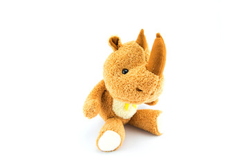 fabric rhino doll on white background - cute toy and copy space
