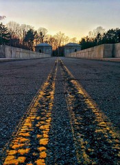 Yellow lines on cracked road