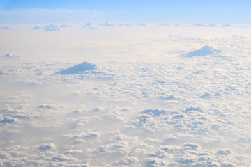 Fototapeta na wymiar Clouds and sky, aerial view from airplane window.