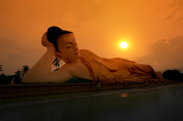 Reclining Buddha in the sunset. Bago, Myanmar.