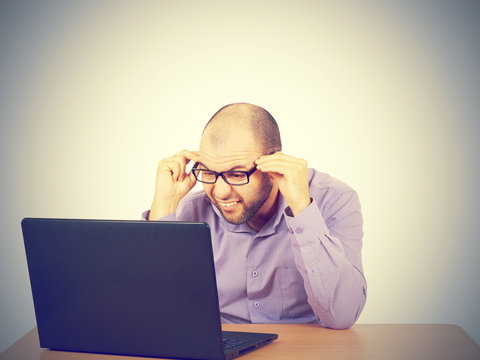 businessman bald with beard wearing shirt and glasses