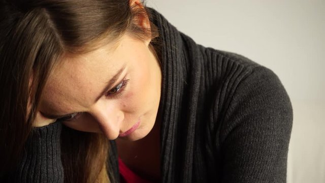 Woman face sad and stressed  closeup 4K