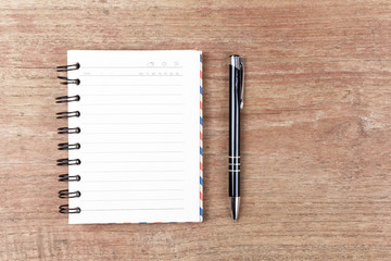 Blank open notebook with black pencil on wood table,Business tem