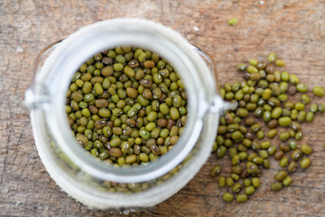 Mung beans in glass jar. Selective focus to emphasize.