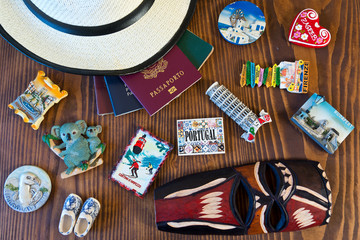 various passports and souvenir magnets from several world country