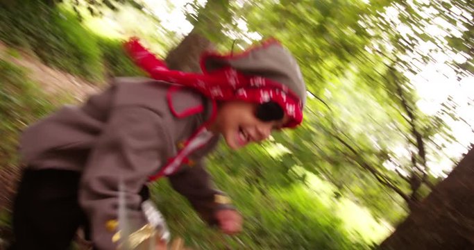 Boy dressed up as pirate excited with toothy smile