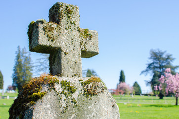 Grassy Graveyard Cross / Gravestone at a cemetery in East Vancouver, BC, Canada