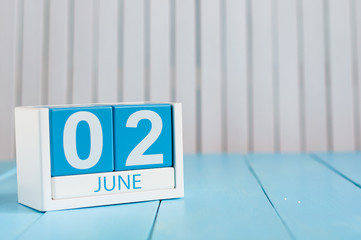 June 2nd. Image of june 2 wooden color calendar on white background.  Summer day, empty space for text