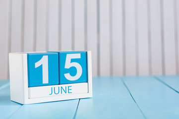 June 15th. Image of june 15 wooden color calendar on white background. Summer day. Empty space for text. Global Wind Day. Tax DAY