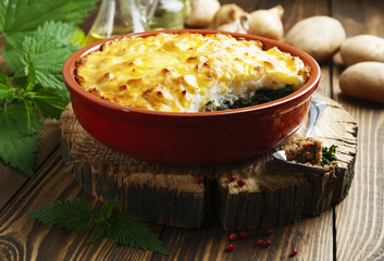 Potato casserole with meat and nettle