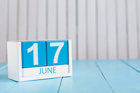June 17th. Image of june 17 wooden color calendar on white background. Summer day. Empty space for text
