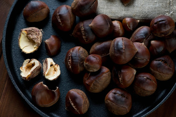 Closeup of roasted chestnuts, selective focus, studio shot
