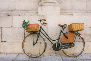Fototapeta na wymiar Beautiful italian bicycle with baskets
