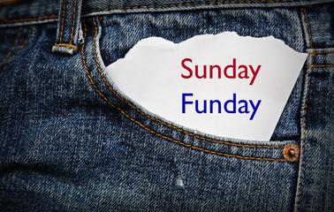 Blue jean pocket with Sunday fun day word