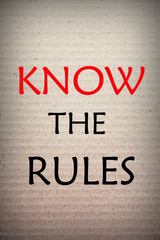 Know the rules word on cardboard background