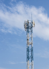 Mobile phone tower on the sky background.