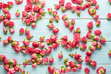 Roses on wooden background