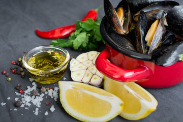 Casserole with mussels, lemons, chili pepper and spices