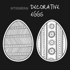 Black, white decorative eggs. Set of stickers on black background. 