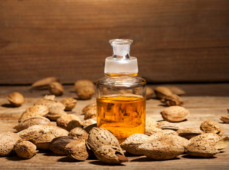 Almond oil on an old wooden background