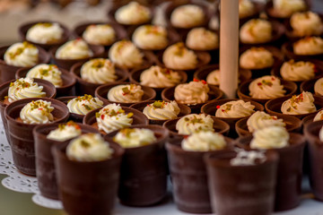 Chocolate cupcakes with cream inside and side light