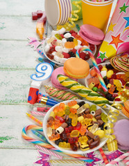 Fototapeta na wymiar Colorful sweets and items for children's birthdays