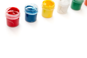 Gouache paint in jar isolated on white background.