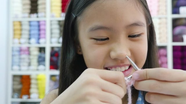 4K : Close up of Asian girl practice to knitting