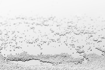Abstract silver background with metal particles. The texture.