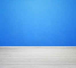room interior with blue concrete wall and white wood floor
