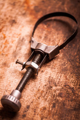 Oil filter removal tool on wooden plank