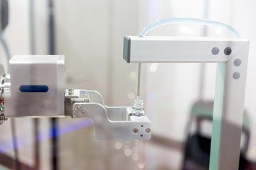 Robot mechanical arm with chemical tubes in a medical laboratory
