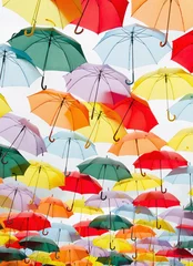 Fotobehang Colorful umbrellas floating on the sky © Alfonsodetomas