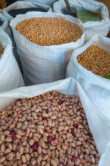 Obraz premium Variety of legumes in white bags